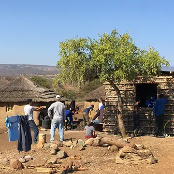 Team Building a House in the Village Mission Trip
