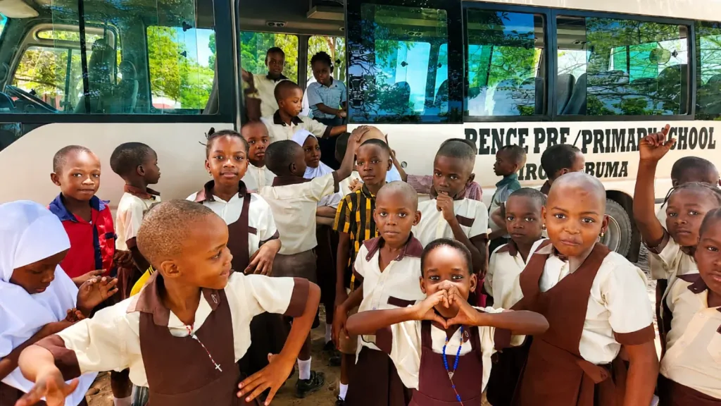 Students arrive at Lawrence Academy by bus before their lessons begin
