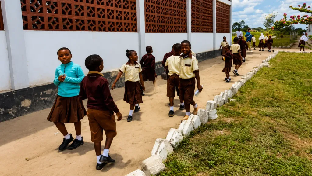 Students walk across campus to get to their classrooms at Lawrence Academy